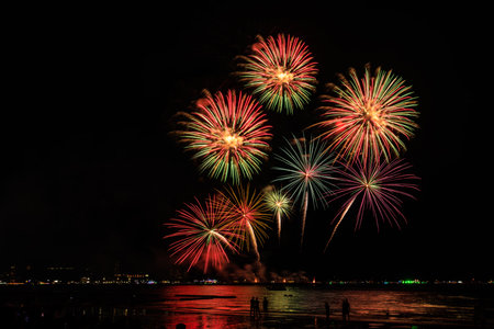 PATTAYA, CHONBURI, THAILAND, Real Fireworks at Pattaya bay, Pattaya national Fireworks Festival contest, November of every Year, Beautiful of bright light fireworks Show in middle sea, for postcard wallpaper backgrounds.の写真素材