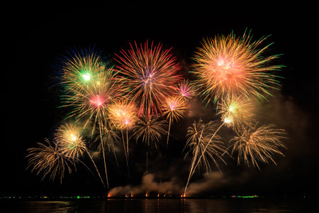 PATTAYA, CHONBURI, THAILAND, Real Fireworks at Pattaya bay, Pattaya national Fireworks Festival contest, November of every Year, Beautiful of bright light fireworks Show in middle sea, for postcard wallpaper background photo, conceptの写真素材