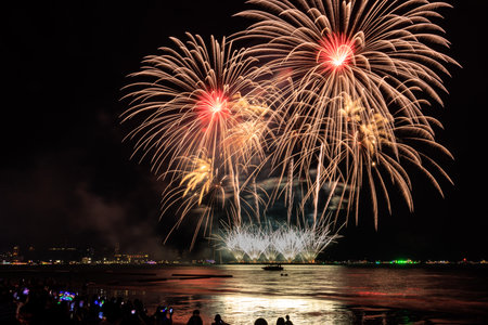 PATTAYA, THAILAND, Real Fireworks at Pattaya bay, Pattaya national Fireworks Festival contest, November of every Year, Beautiful of bright light fireworks Show for postcard, wallpaper, background, photo, web, page, magazine, social.の写真素材