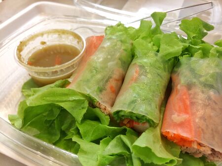 Salad roll with seafood sauce for healthy food by vegetable tuna carrot crab, clean food for diet.の写真素材