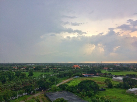 Black clouds cover rural area, rain will fallの写真素材