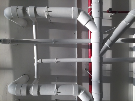 PVC Piping hanging underpass building inside the building.の写真素材