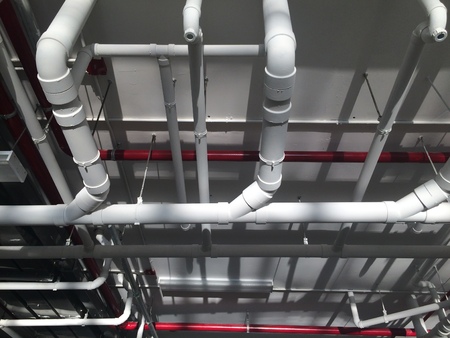 PVC Piping hanging underpass building inside the building.の写真素材