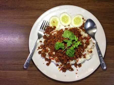 Chili catfish with rice and herbの写真素材
