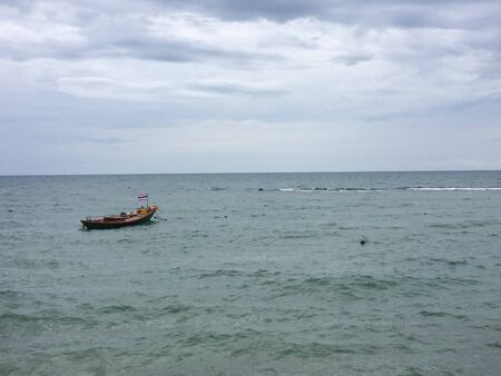 Fishing small boat floating on the waterの写真素材