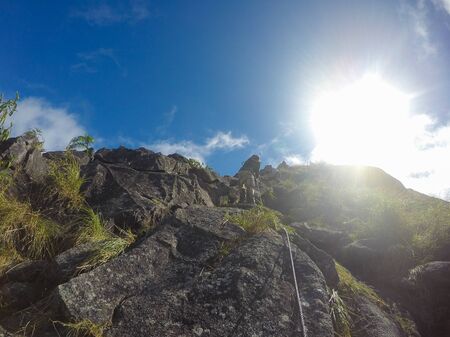 People climbing the steep frontの写真素材