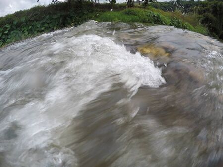 Slow motion waterfalls running at a streamの写真素材