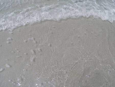 Sandy ground and clear water beachの写真素材