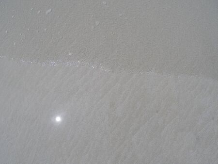 Sandy ground and clear water beachの写真素材