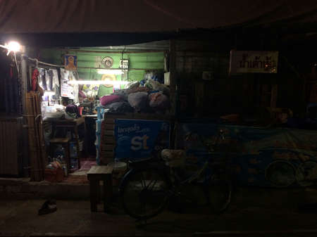 Prachuap Khiri Khan, Thailand-February 9, 2020 : The shop accepts, corrects, or repairs clothing that is still working at night.のeditorial素材