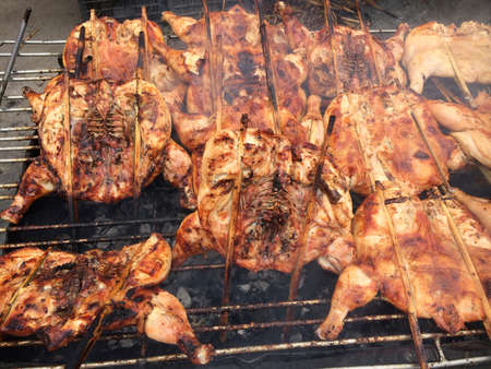 Grilled chicken cooked on bbq gridの写真素材