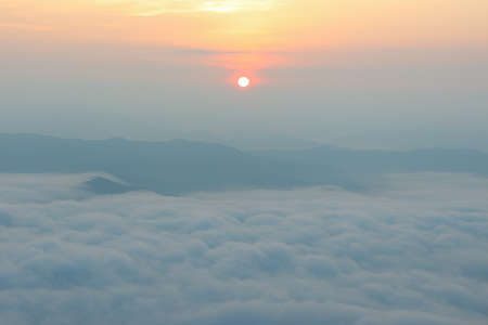 foggy landscape of mist at sunriseの写真素材