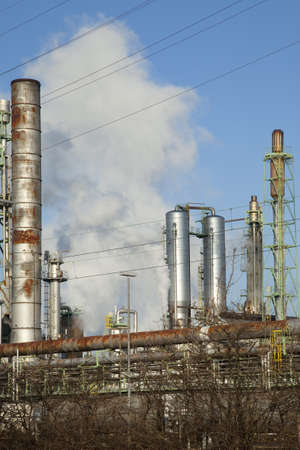Chimneys of large industrial plants pollute the environment