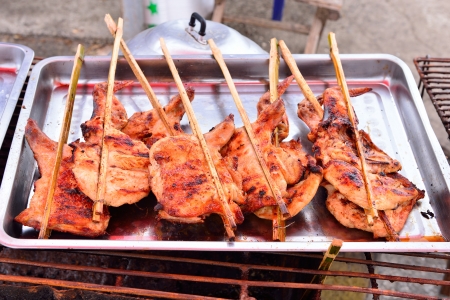 Grilled chicken are on a stainless trayの写真素材