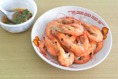 Hot steamed shrimps and seafood sauceの写真素材