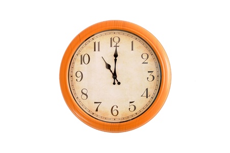 Clock showing 11 o clock on a white wallの写真素材