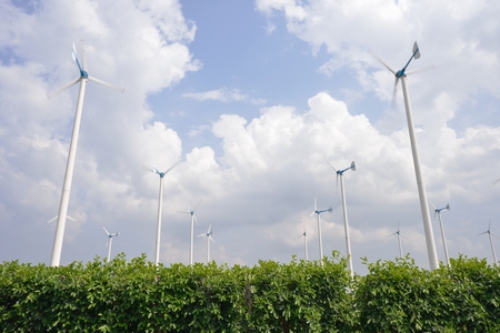 Wind turbine energy source landscape with cloudy skyの写真素材