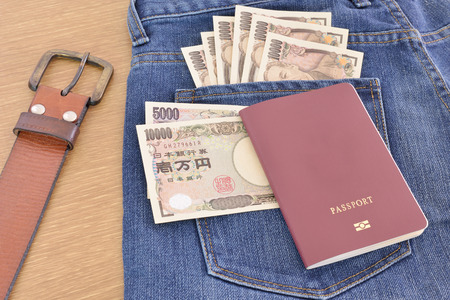Japanese banknotes on jeansの写真素材