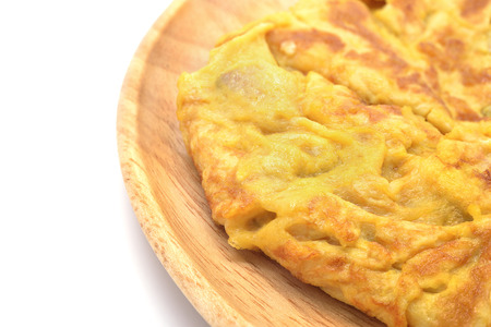 Isolated omelet on wooden dishの写真素材