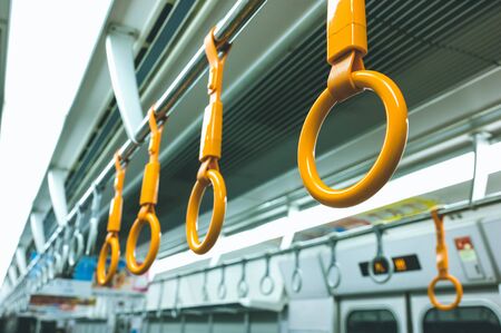 Yellow handrails in Japan train, selective focus, vintage colorの写真素材