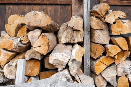 Pile of firewood, Stacked firewood logs for winter heatingの写真素材