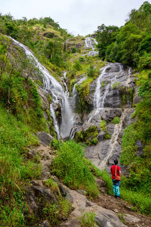 Petolosu, The highest waterfall with a standing hiker, the heart-shaped waterfall in Thailand at Umphang wildlife sanctuary, Tak provinceの写真素材
