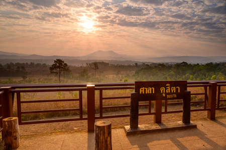 Sunrise behind mountain view at Sala Dusita sunrise viewpoint, Thung Salaeng Luang national park, Thailand: TEXT TRANSLATION: Dusita Standの写真素材