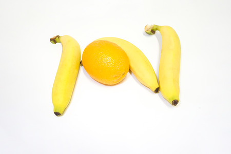 Bananas and oranges on whiteの写真素材