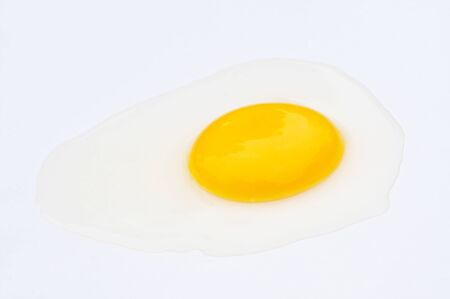 Broken egg isolated on white background の写真素材