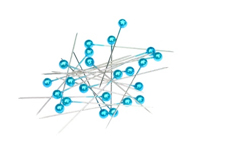 Blue pins on white background 