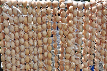 Home made meat salami sausage at street market hanging in line to make good tastyの写真素材