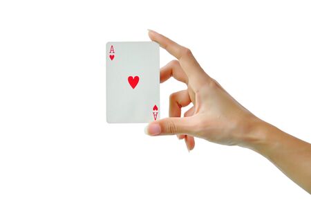 Playing cards in hand isolated on white backgroundの写真素材