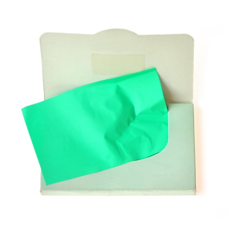 Oil absorbing (blotting) sheets to remove excess oil on oily face の写真素材