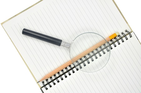 Blank notebook and pencil on white background,magnifyi ng glass の写真素材