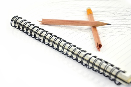 Broken pencil on notebookの写真素材