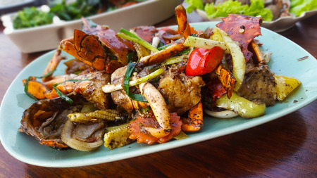 Fresh crabs cooked with black pepper sauce on plateの写真素材