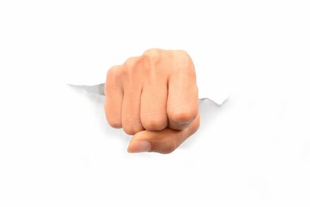Woman fist punching paper isolated on white backgroundの写真素材