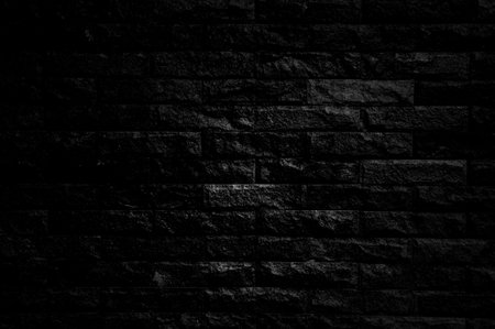 Background of black brick wall textureの写真素材