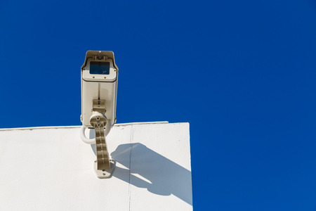 CCTV on building with blue-sky background