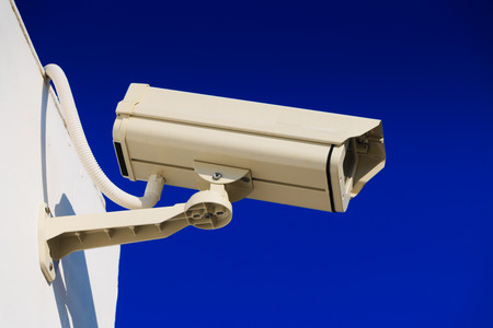 CCTV on building with blue-sky background