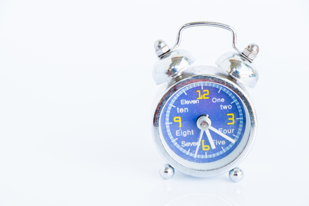 Alarm clock on white の写真素材