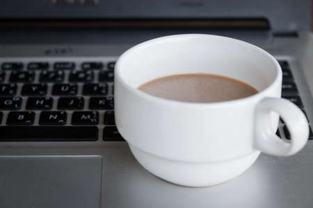 coffee cup put on laptopの写真素材