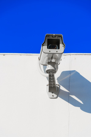 CCTV on building with blue-sky backgroundの写真素材