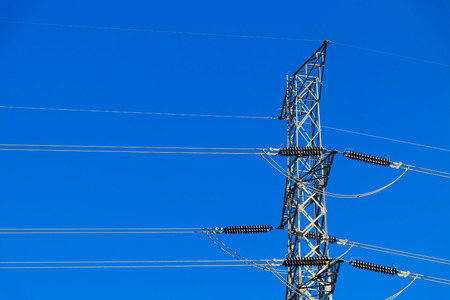 high-voltage tower in the blue-sky background