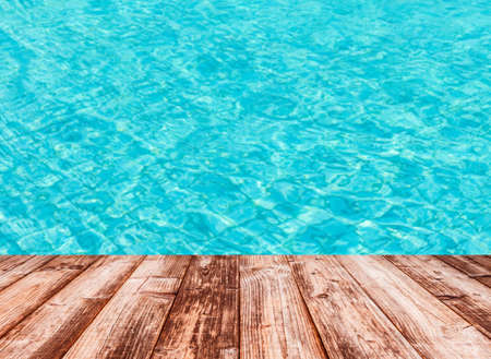 Coconut plank under image of peaceful sea with clear sky.