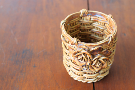 vintage basket on brown deskの写真素材