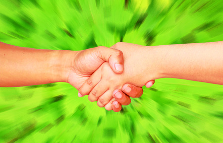 hands holding  green backgroundの写真素材