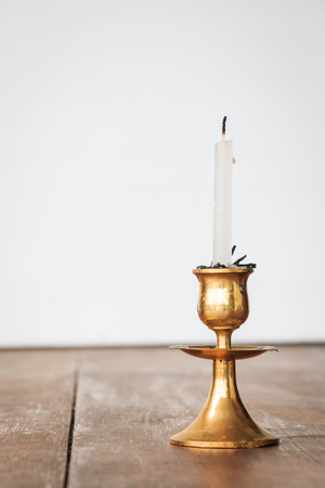 Golden holder with handle on brown desk.の写真素材