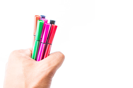 man's hand holding the colorful markers. isolatedの写真素材