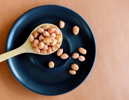 Peanuts put on plate on the table.